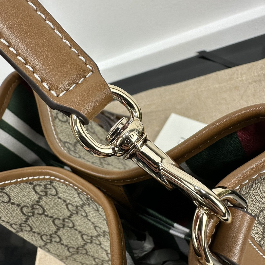 Gucci GG Emblem Small bucket bag in beige and ebony coated canvas with brown leather trim