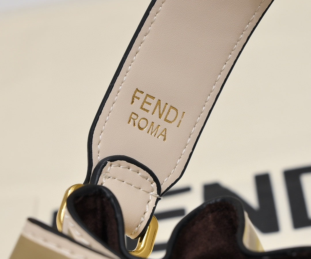 Fendi Mini Mon Trésor bucket bag in a beige and white FF jacquard fabric and leather