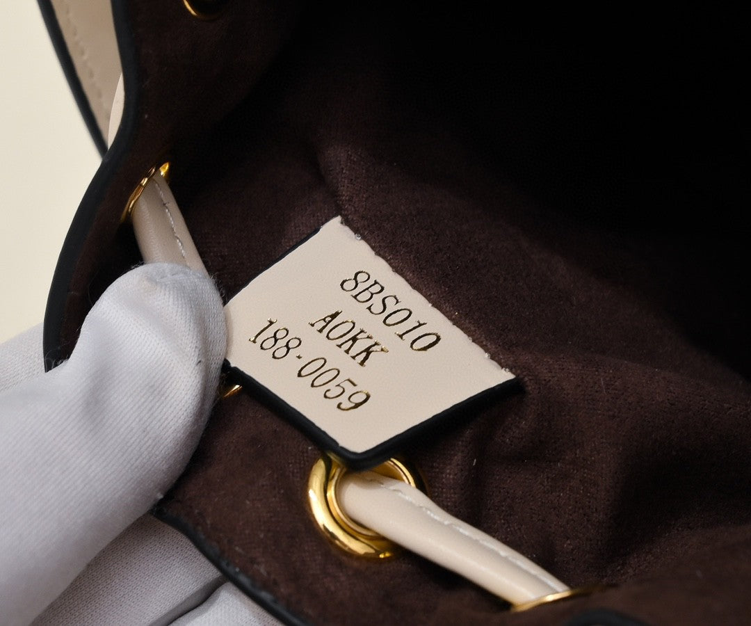 Fendi Mini Mon Trésor bucket bag in a beige and white FF jacquard fabric and leather