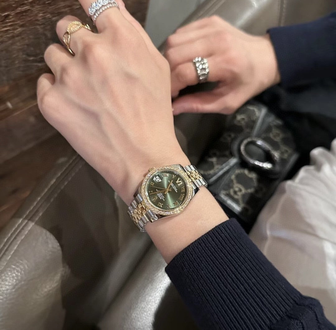 Rolex Datejust watch with a green dial, two-tone