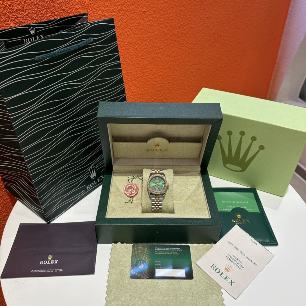 Rolex Datejust watch with a green dial, two-tone