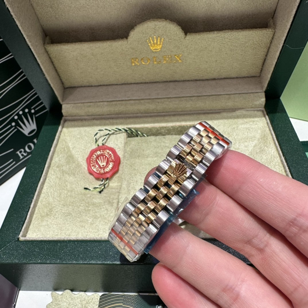 Rolex Datejust watch with a green dial, two-tone