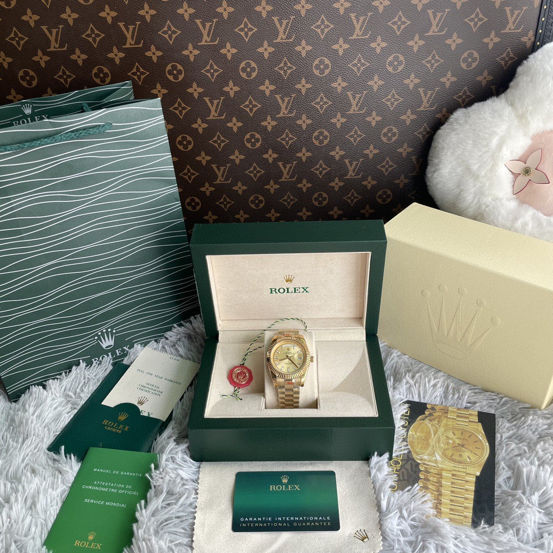 Rolex Day-Date 40 reference 228238 in 18k yellow gold with a champagne dial