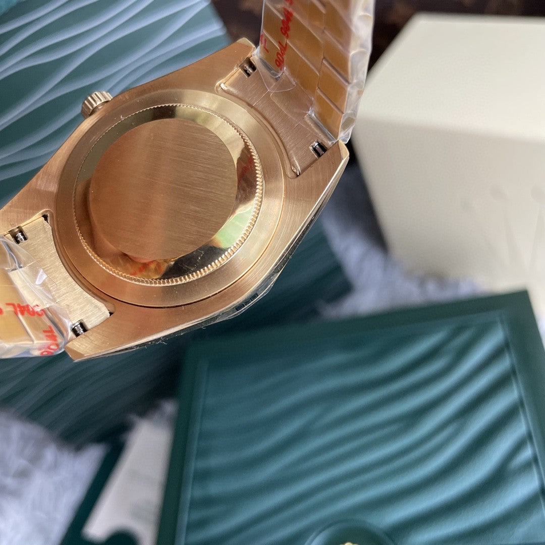 Rolex Day-Date 40 reference 228238 in 18k yellow gold with a champagne dial