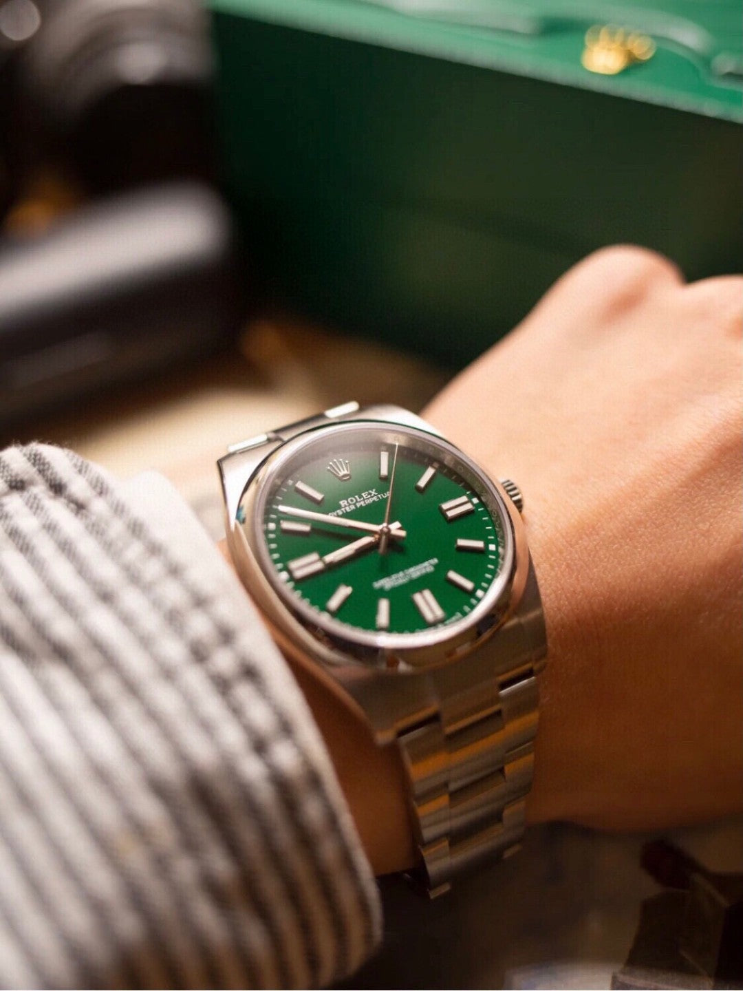 Rolex Oyster Perpetual watch in Oystersteel with a green dial