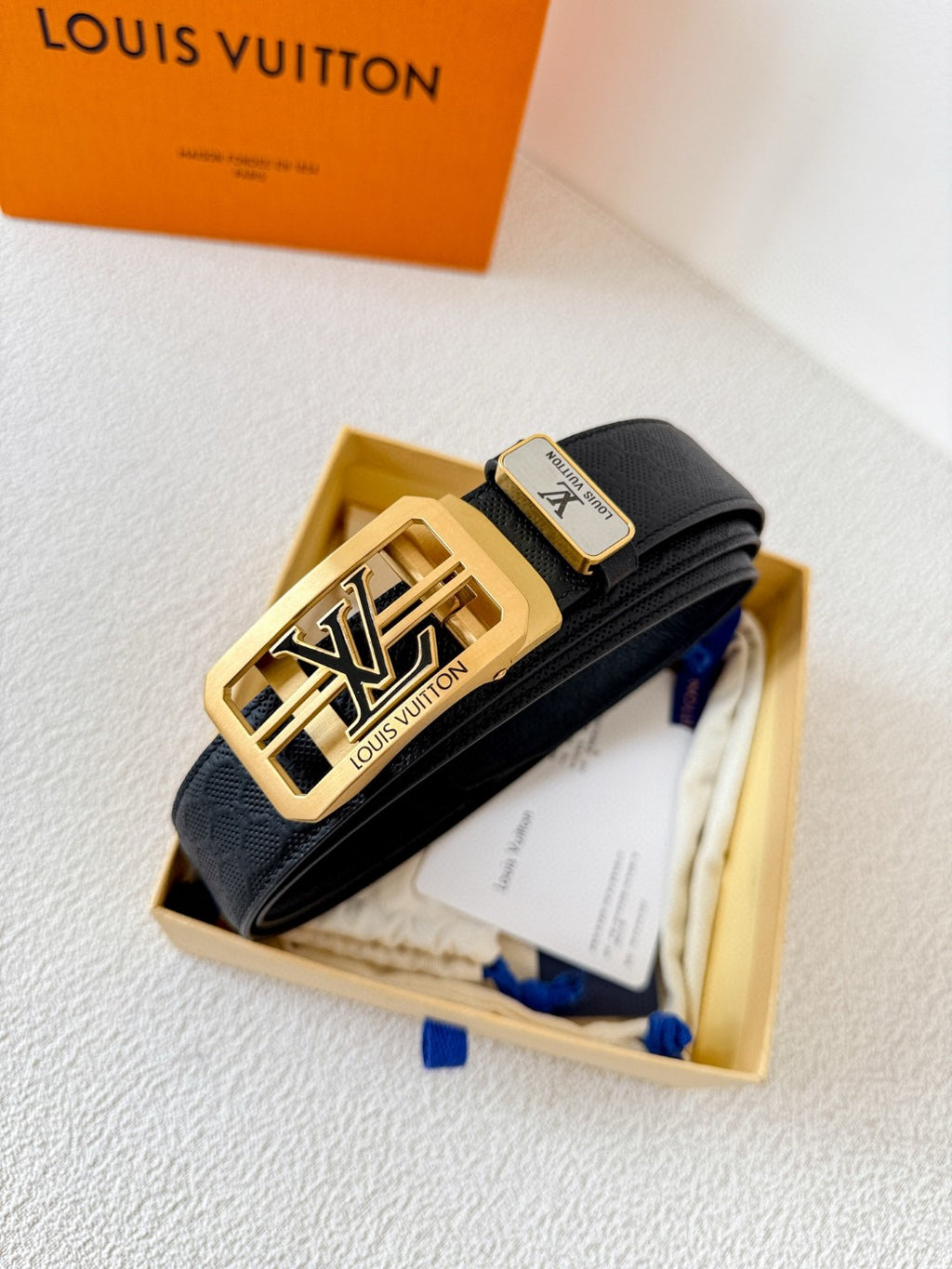 Louis Vuitton reversible leather belt with a gold LV logo buckle