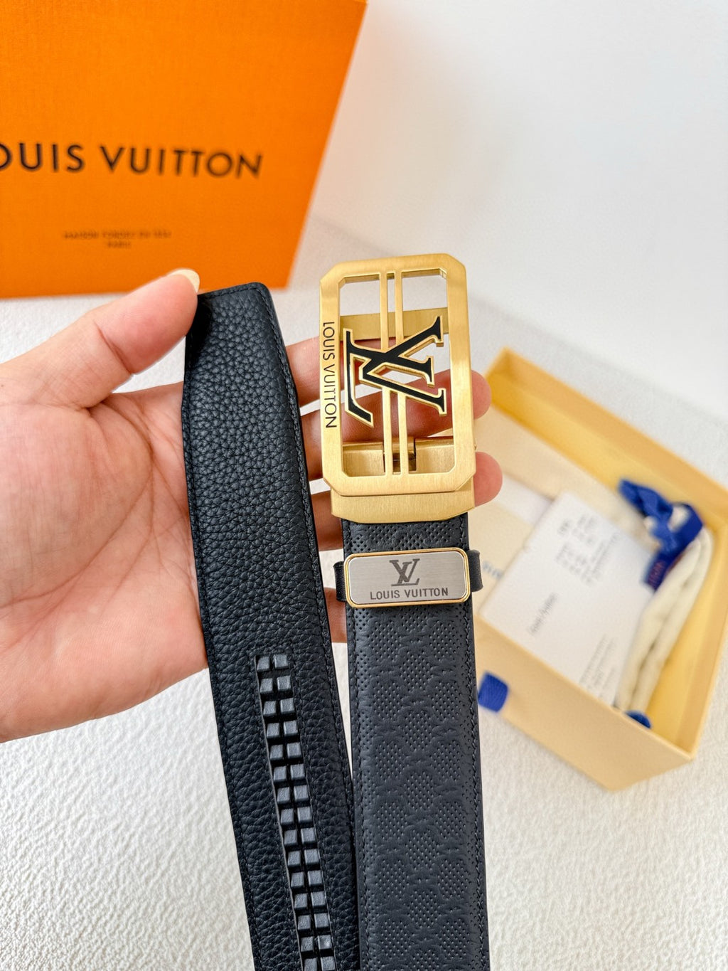 Louis Vuitton reversible leather belt with a gold LV logo buckle