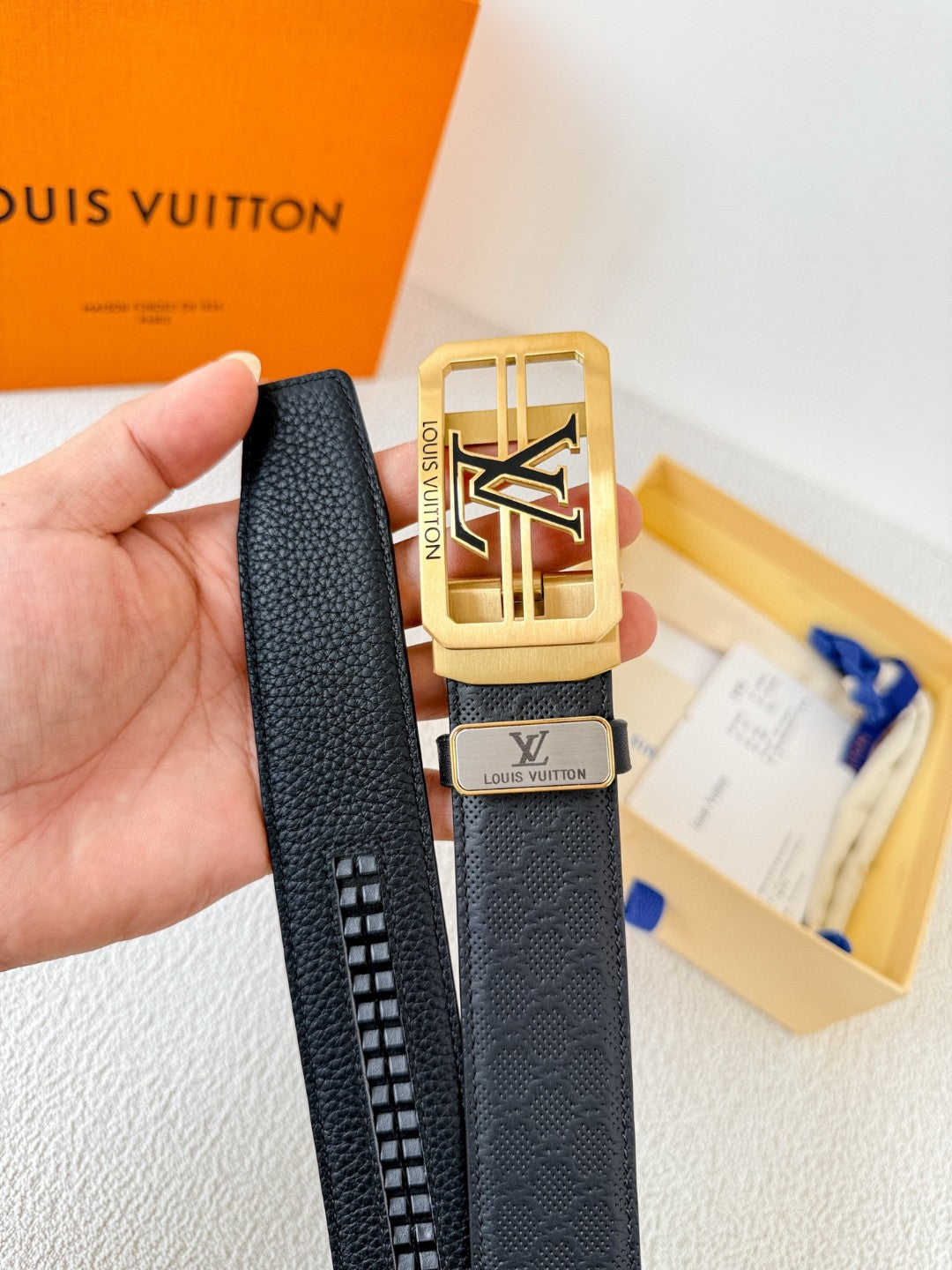 Louis Vuitton reversible leather belt with a gold LV logo buckle