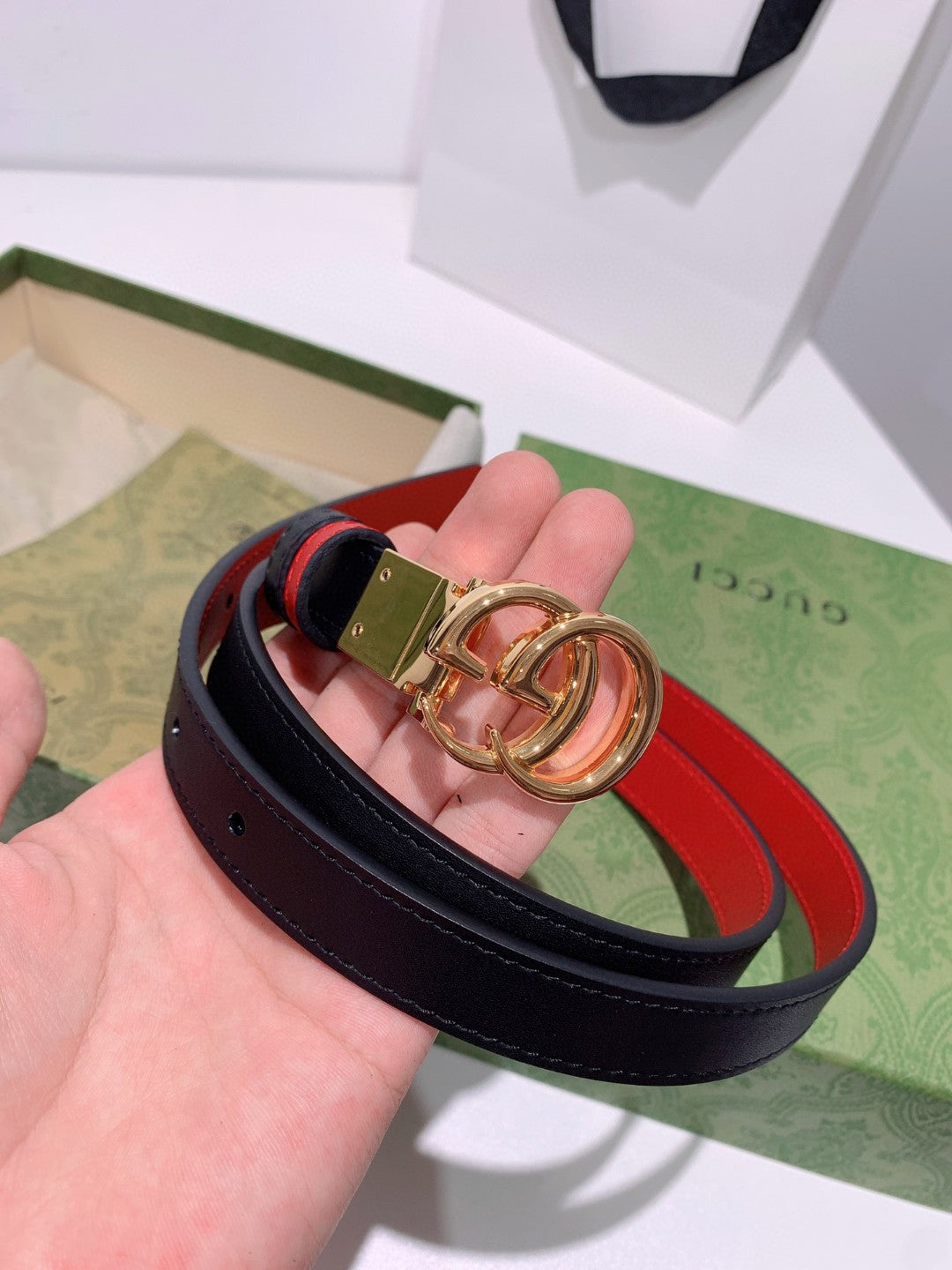 Gucci reversible leather belt in black and red with a gold-toned GG Marmont buckle