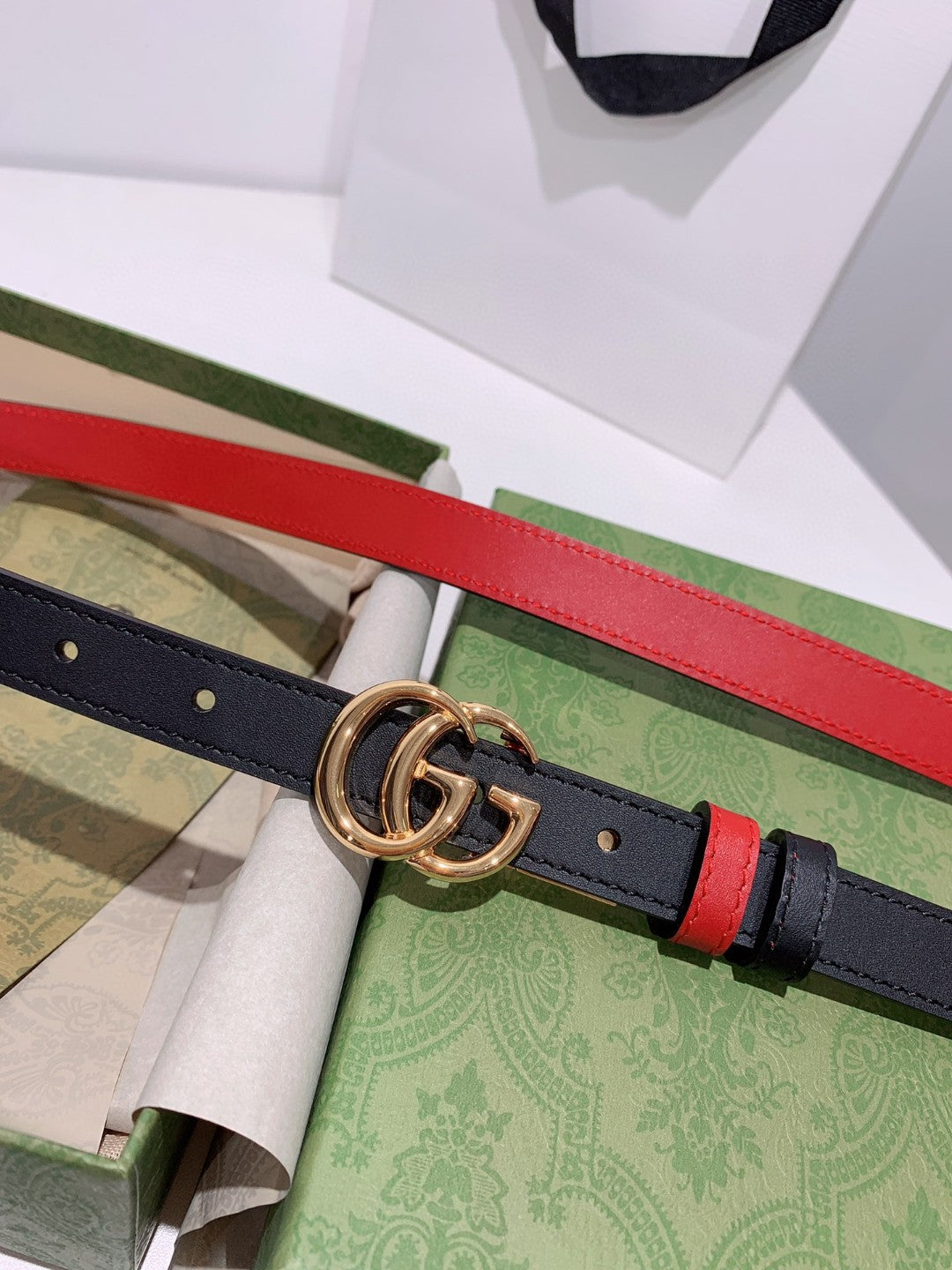 Gucci reversible leather belt in black and red with a gold-toned GG Marmont buckle