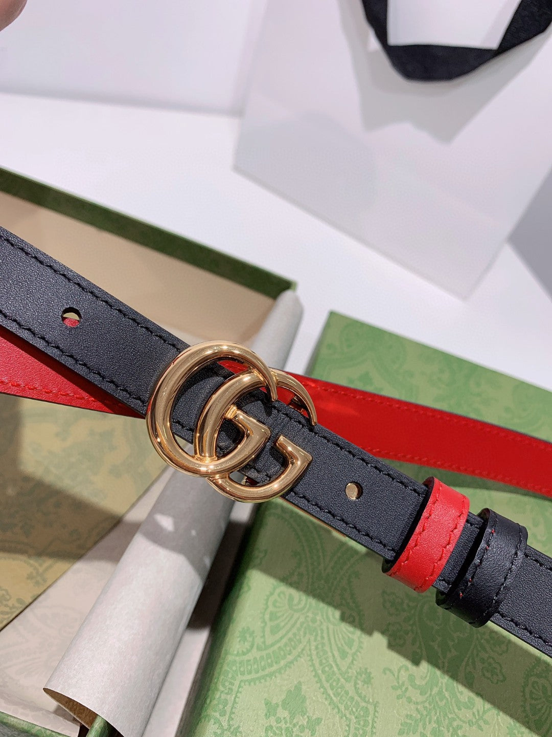 Gucci reversible leather belt in black and red with a gold-toned GG Marmont buckle