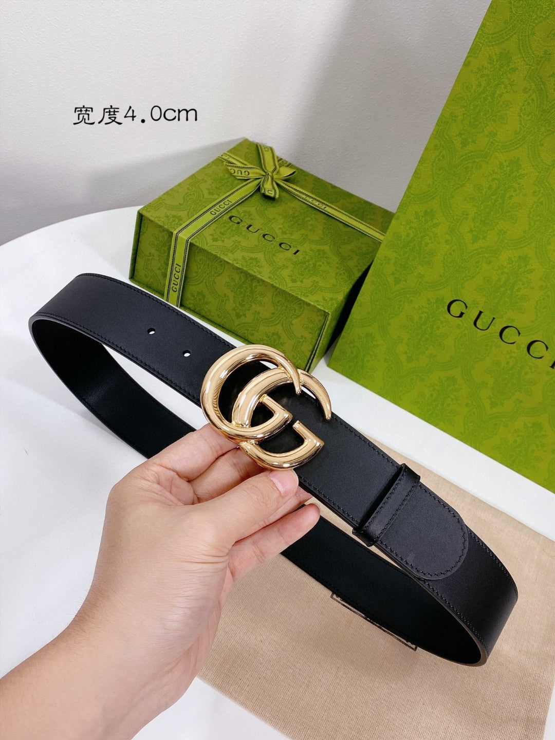 Gucci GG Marmont black leather belt with a shiny gold-toned double G buckle