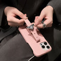 pink Prada Saffiano leather iPhone case with a triangular logo plaque and a strap