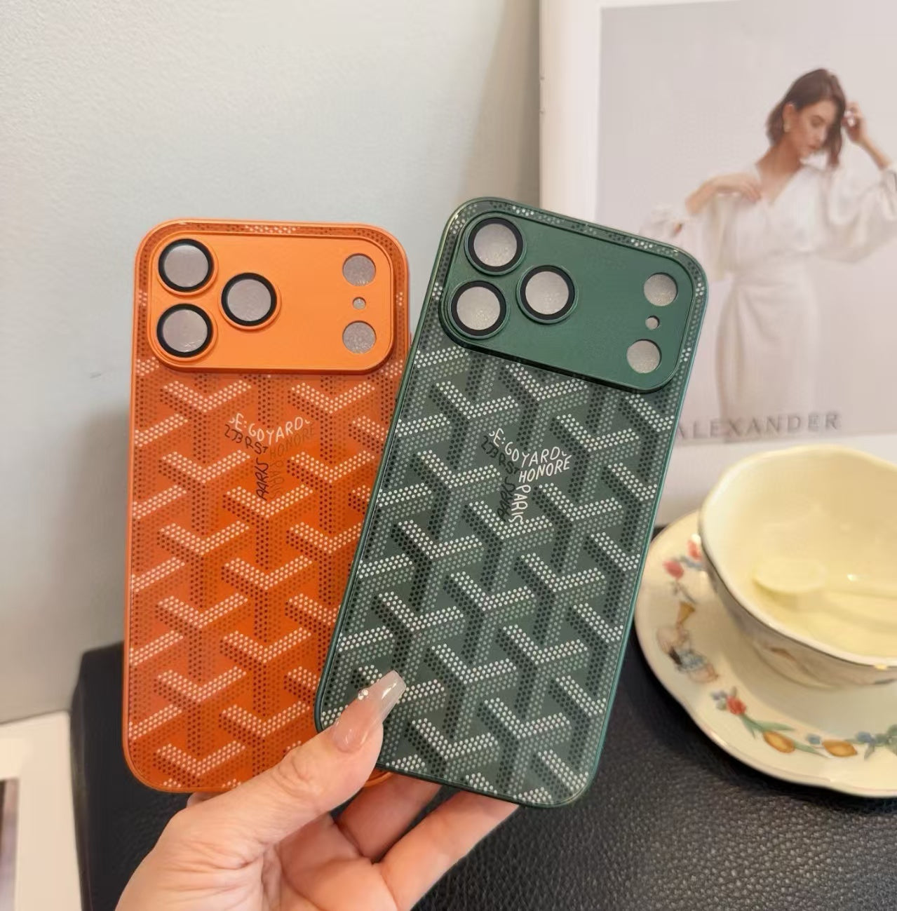 Goyard-style iPhone series cases in orange and green colors