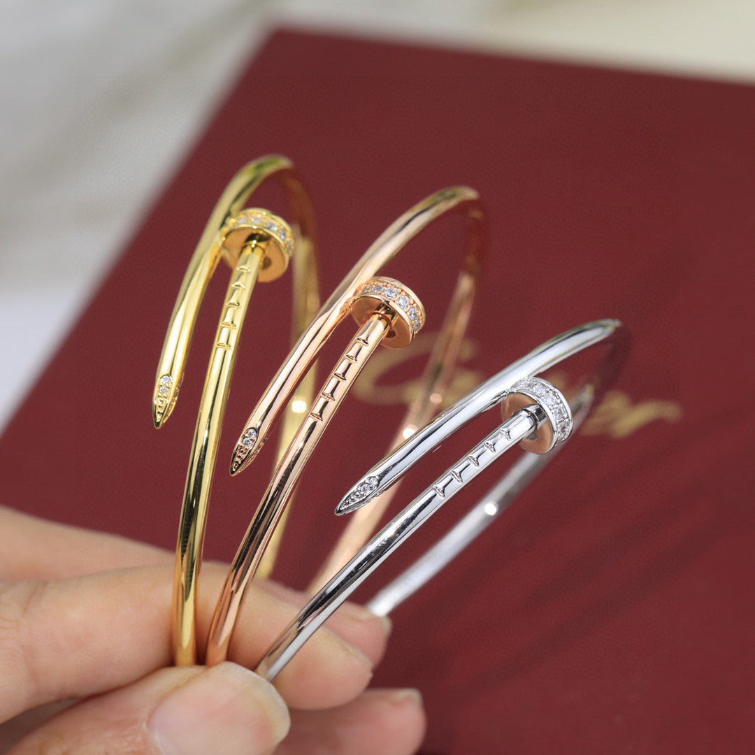 Cartier Juste un Clou bracelets in yellow gold, rose gold, and white gold with diamonds