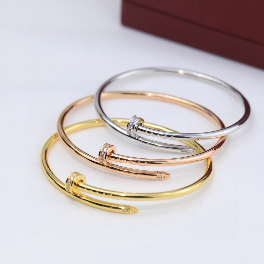 Cartier Juste un Clou bracelets in yellow gold, rose gold, and white gold with diamonds