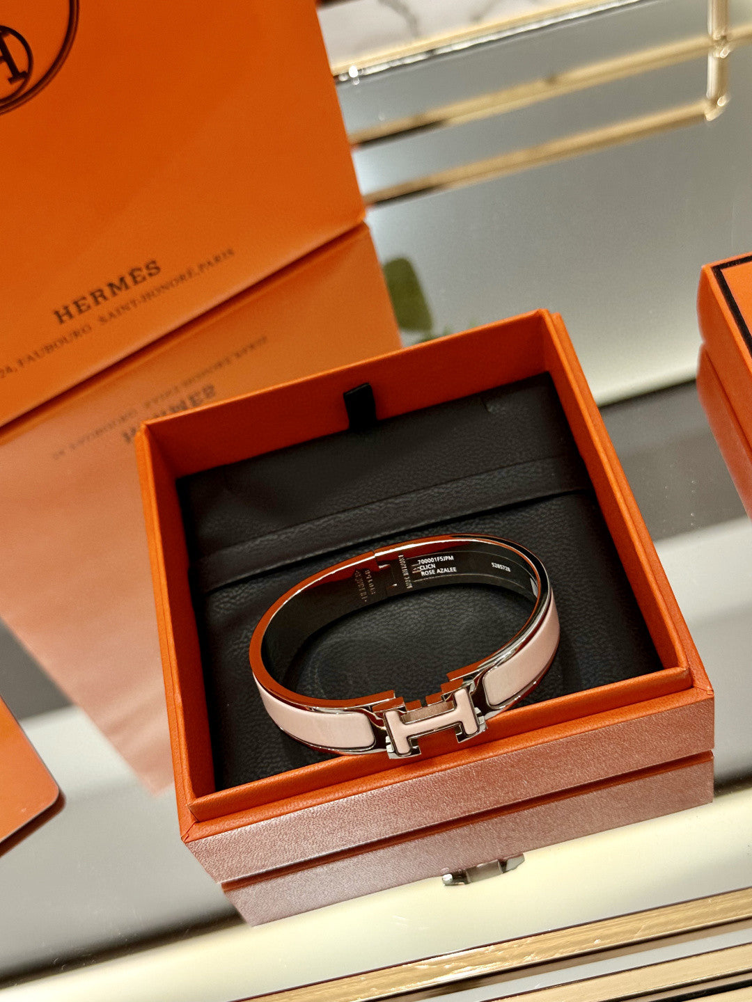 Hermès Clic H bracelet in pink enamel with a rose gold-plated finish
