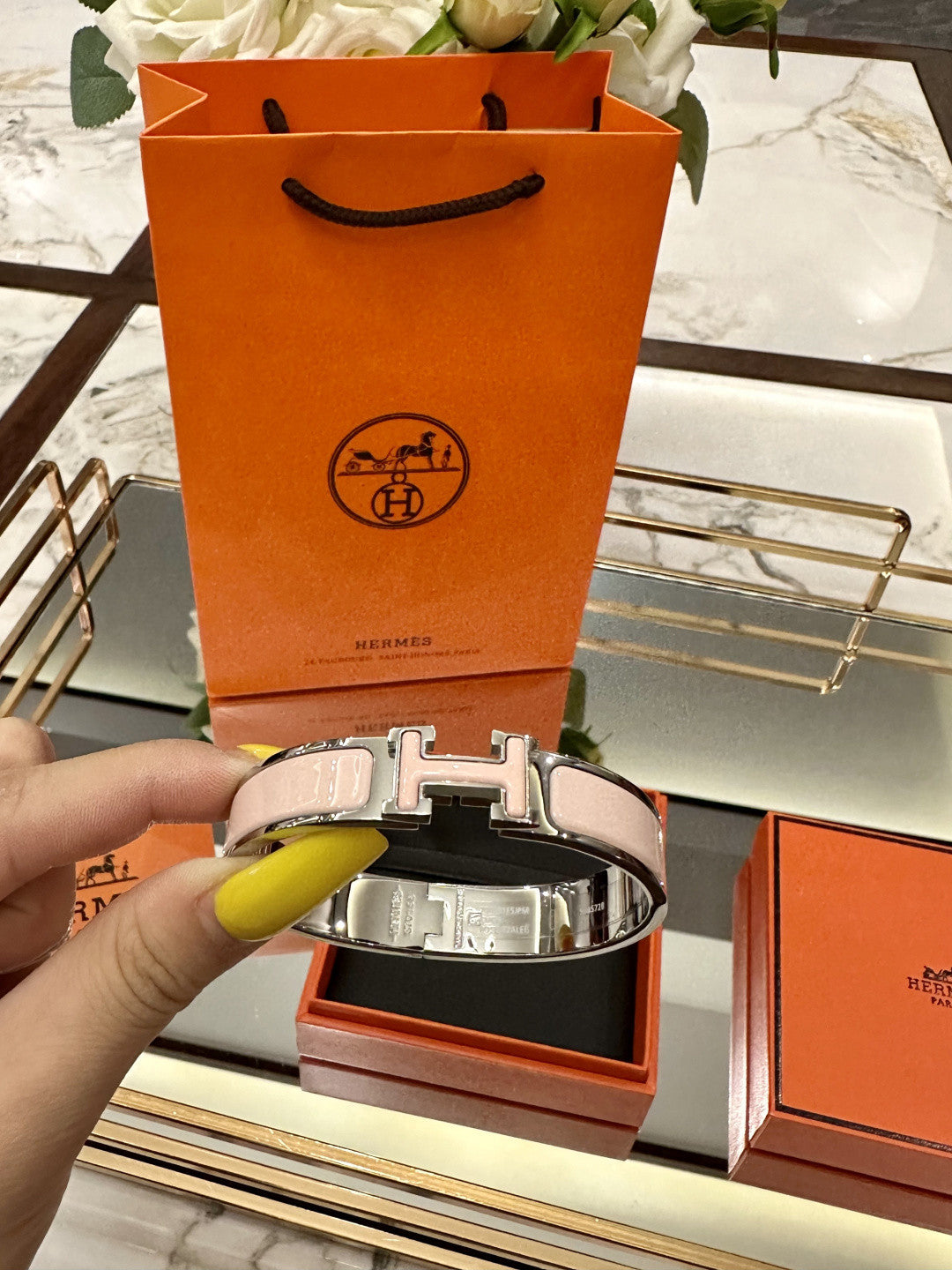 Hermès Clic H bracelet in pink enamel with a rose gold-plated finish