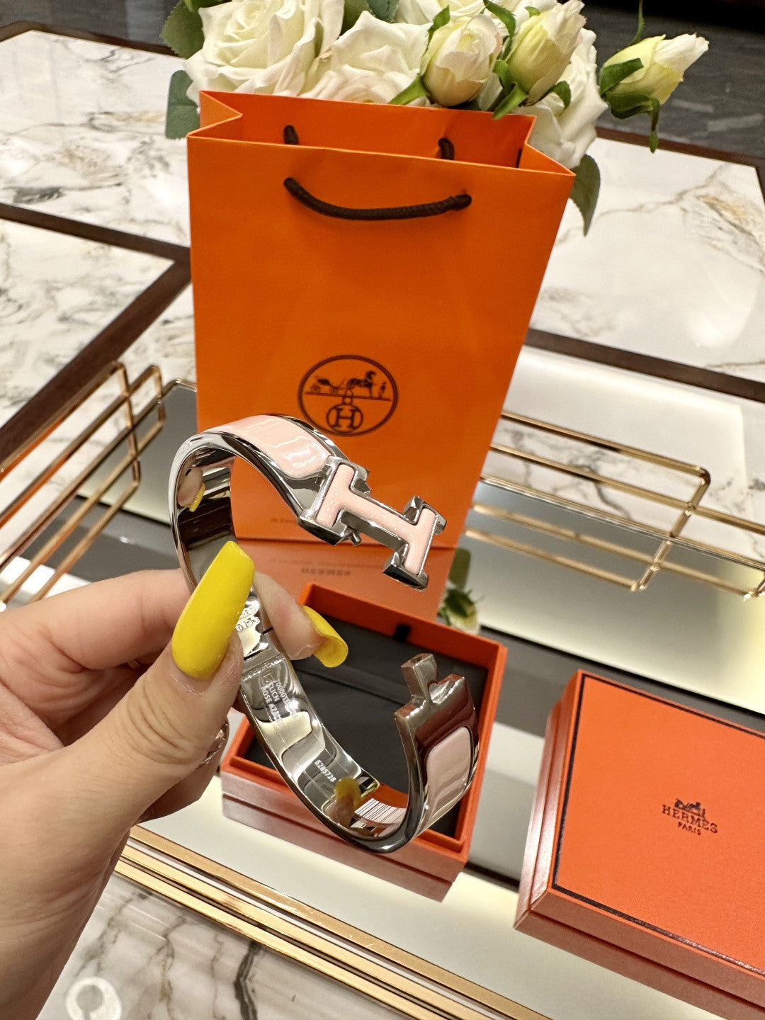 Hermès Clic H bracelet in pink enamel with a rose gold-plated finish