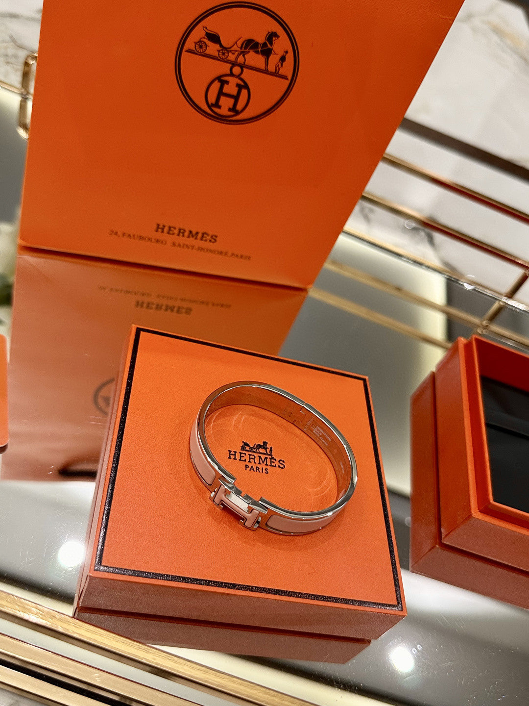 Hermès Clic H bracelet in pink enamel with a rose gold-plated finish