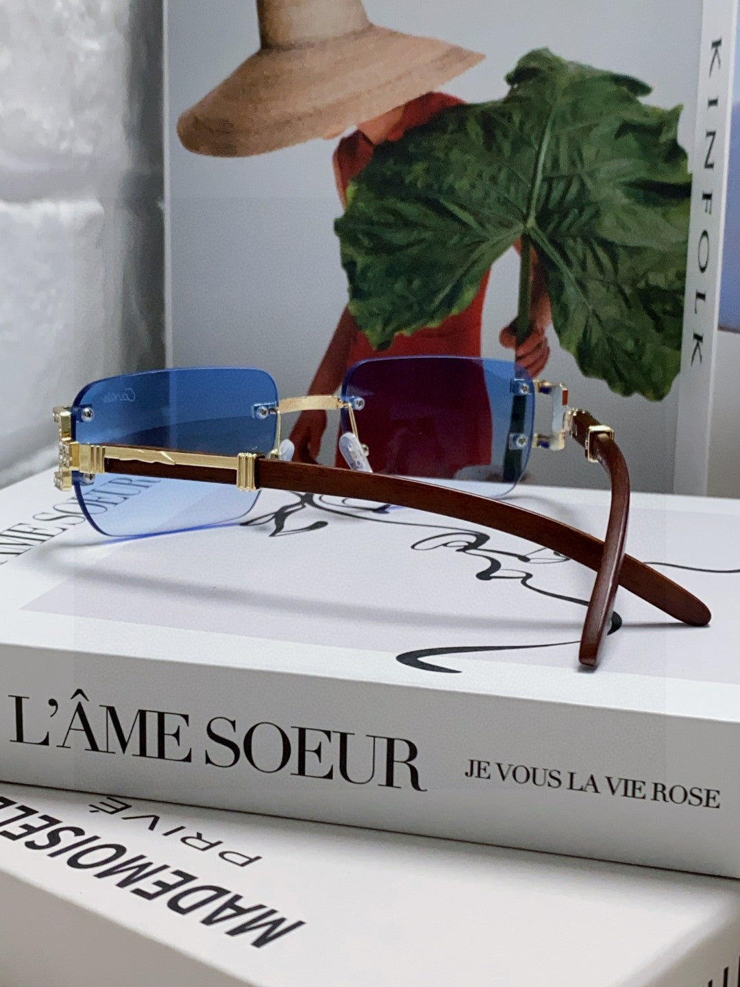 Cartier rimless sunglasses with blue gradient lenses and gold-finish metal