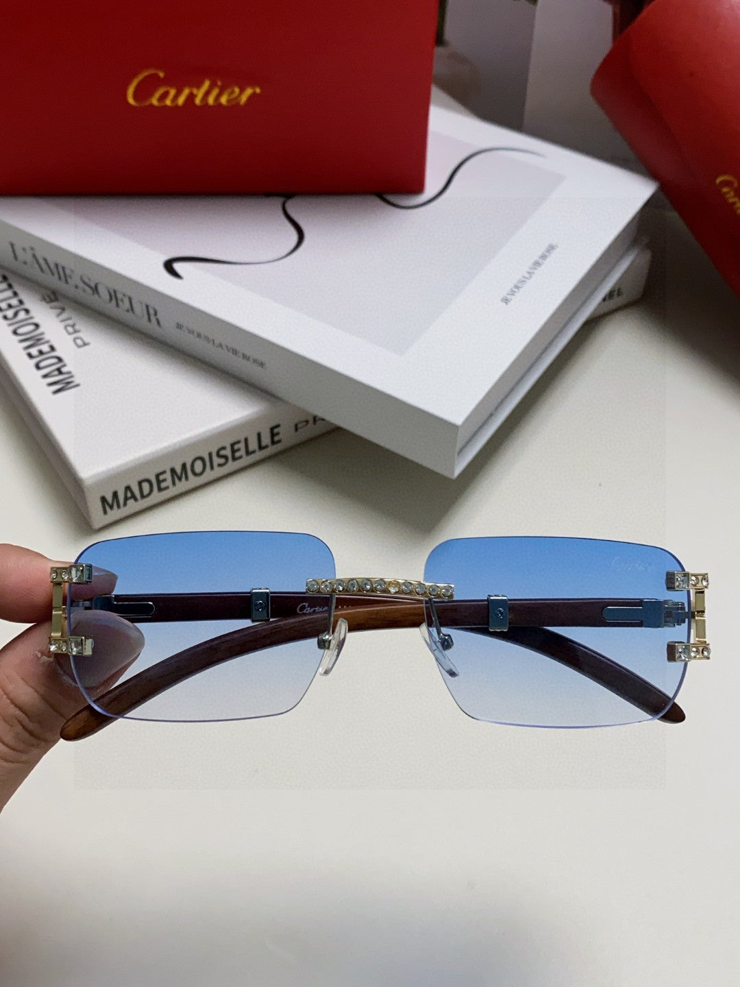 Cartier rimless sunglasses with blue gradient lenses and gold-finish metal