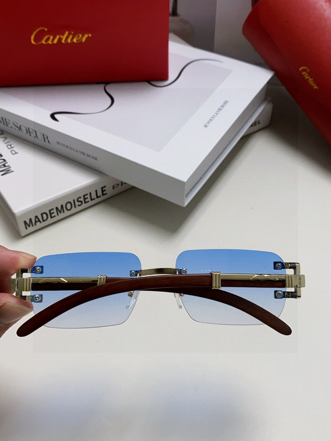 Cartier rimless sunglasses with blue gradient lenses and gold-finish metal