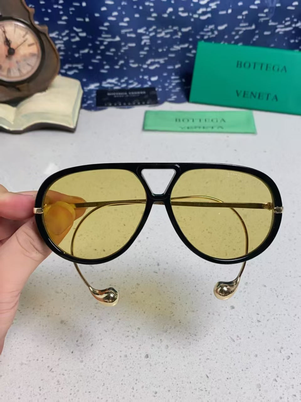 Bottega Veneta BV1273S Drop Aviator sunglasses with a black frame and yellow lenses