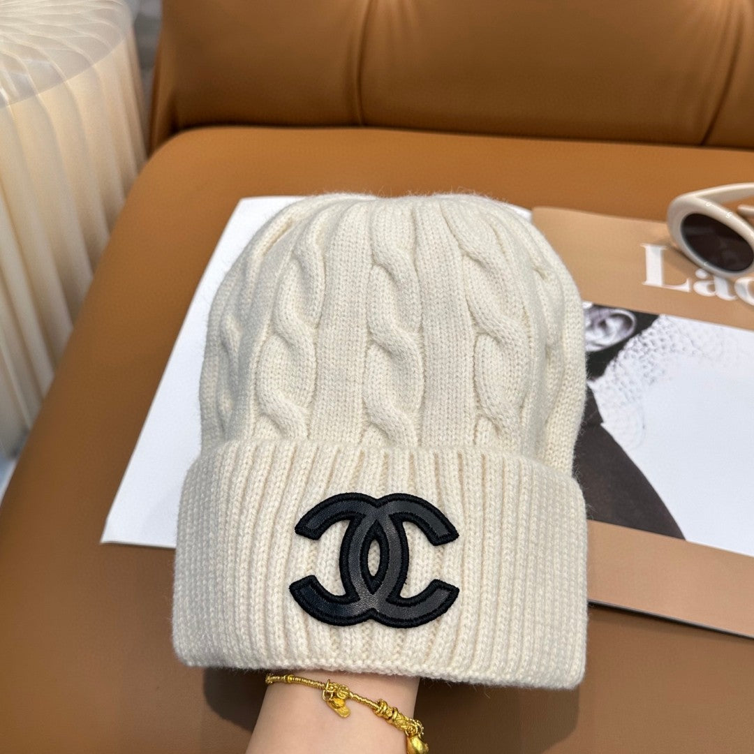 Chanel knit beanie in white with a black CC logo