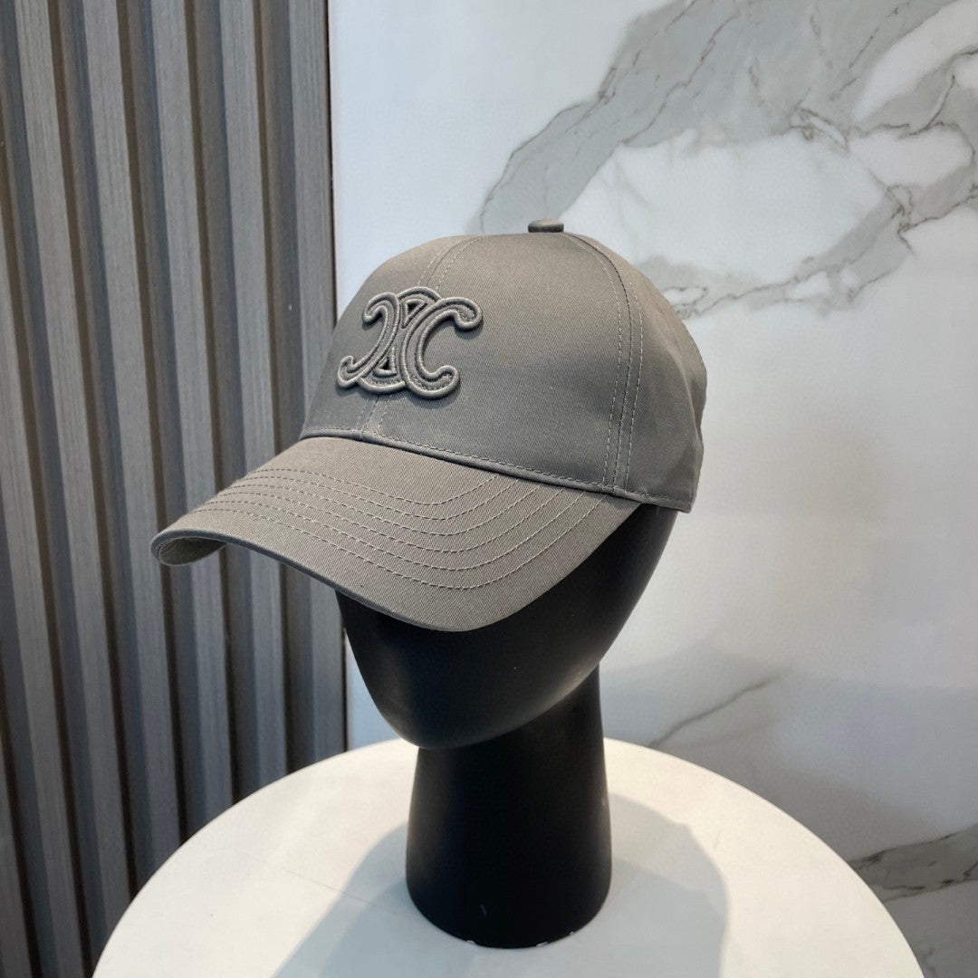 Celine Triomphe Logo-Embroidered Cotton-Gabardine Baseball Cap in pearl grey.