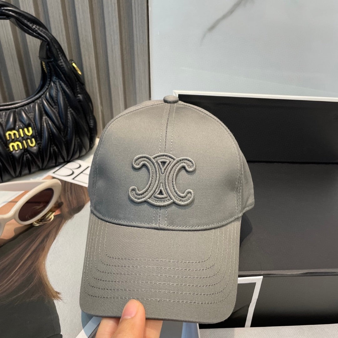 Celine Triomphe Logo-Embroidered Cotton-Gabardine Baseball Cap in pearl grey.