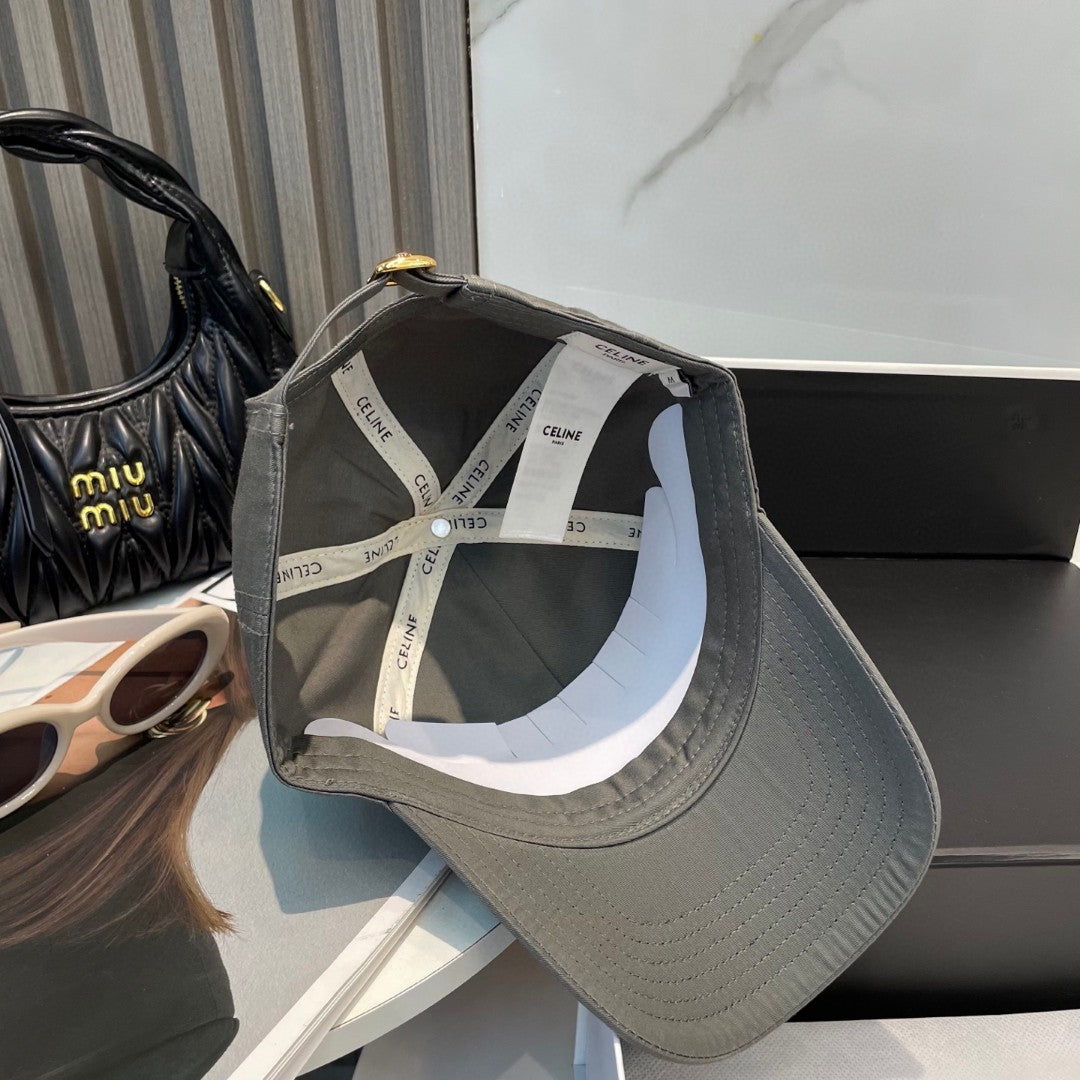 Celine Triomphe Logo-Embroidered Cotton-Gabardine Baseball Cap in pearl grey.