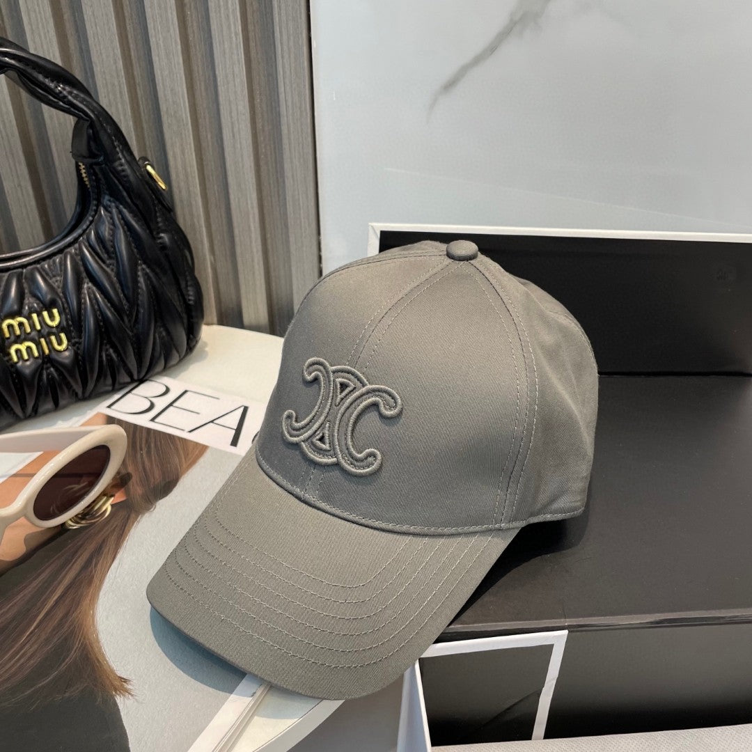 Celine Triomphe Logo-Embroidered Cotton-Gabardine Baseball Cap in pearl grey.