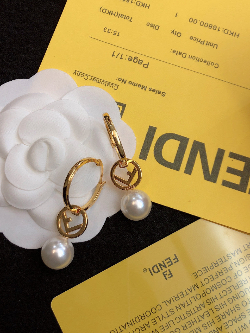 Fendi "F Is Fendi" hoop earrings in a gold-tone finish with a faux pearl drop