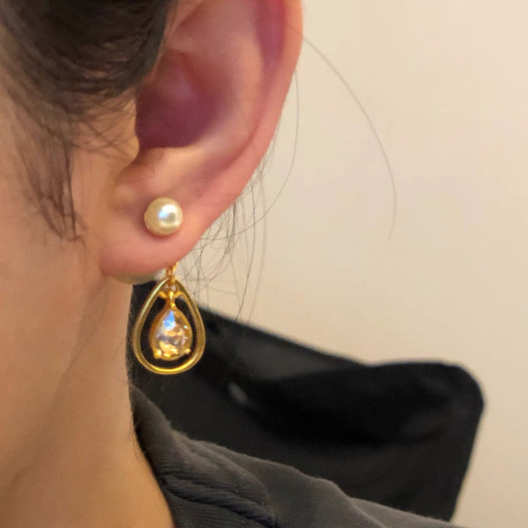 Dior Tribales earrings in gold-finish metal and white resin pearls