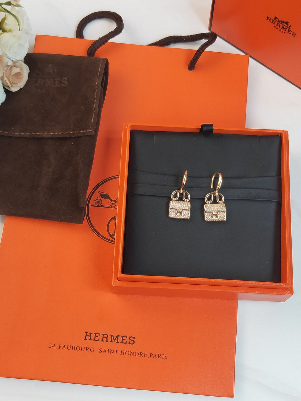 Hermès Amulettes Constance earrings in rose gold with diamond accents