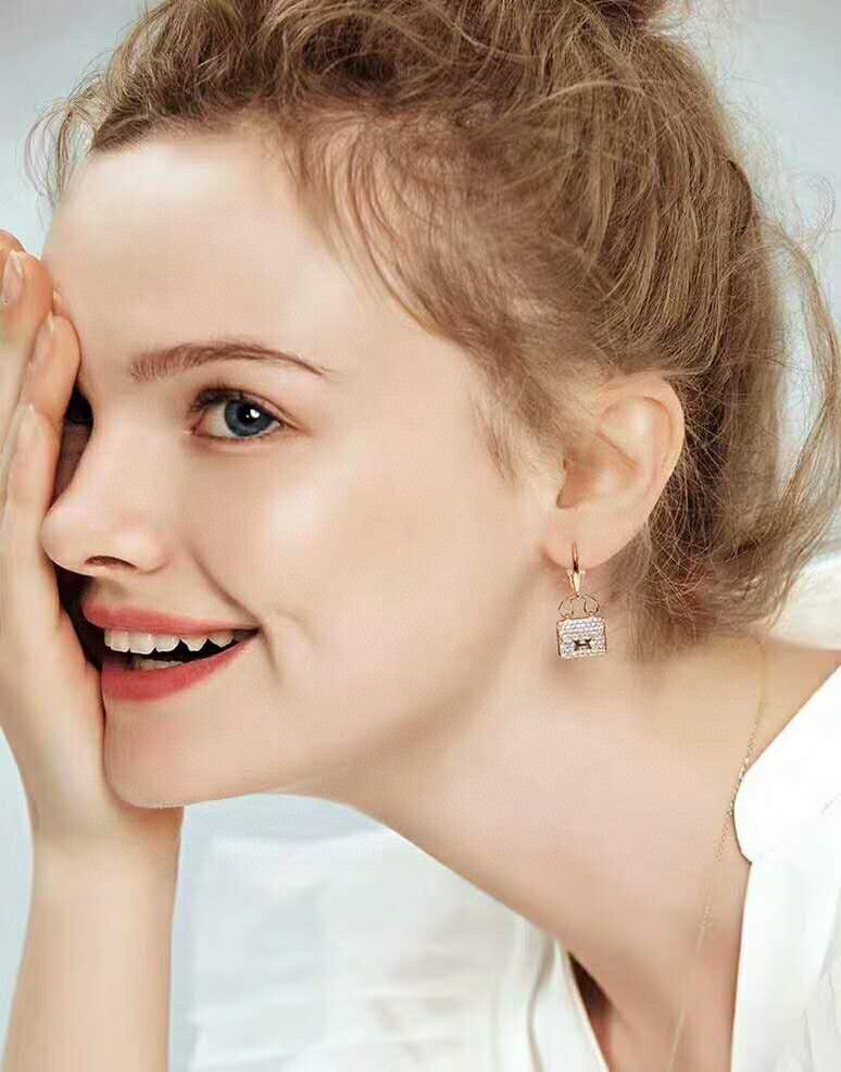 Hermès Amulettes Constance earrings in rose gold with diamond accents