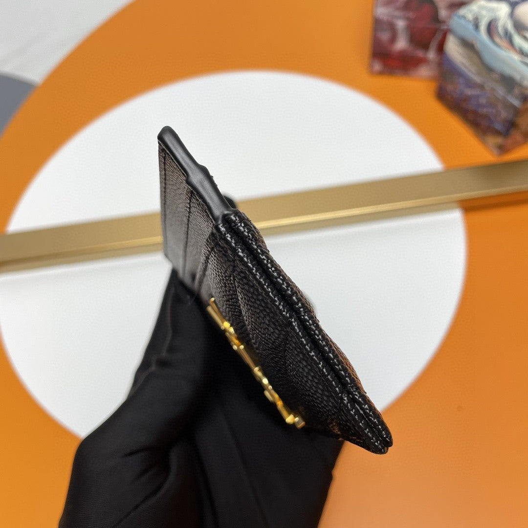 Saint Laurent Cassandre Matelassé card case in black grain de poudre leather with a gold-tone logo