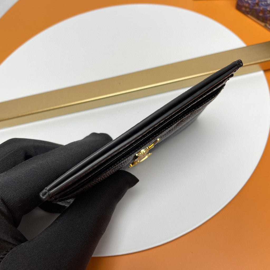 Saint Laurent Cassandre Matelassé card case in black grain de poudre leather with a gold-tone logo