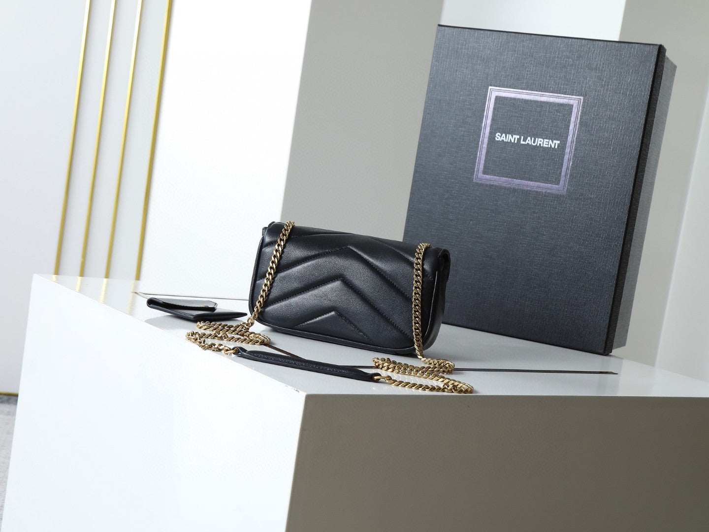 Saint Laurent Loulou mini chain bag in black chevron-quilted lambskin