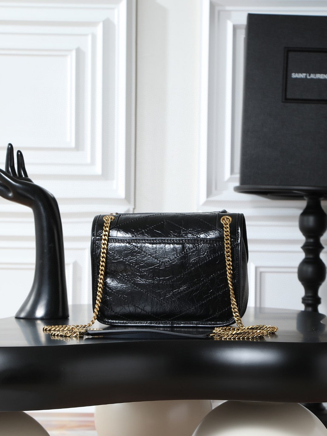 Saint Laurent Niki Baby shoulder bag in black crinkled glossed-leather