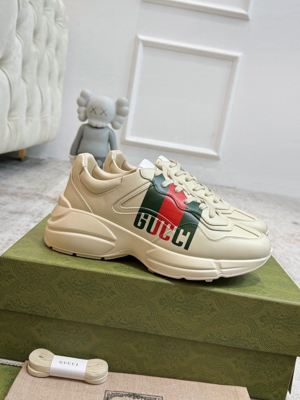 Gucci Men's Rhyton Retro Logo Sneakers in ivory leather with the signature green and red web print