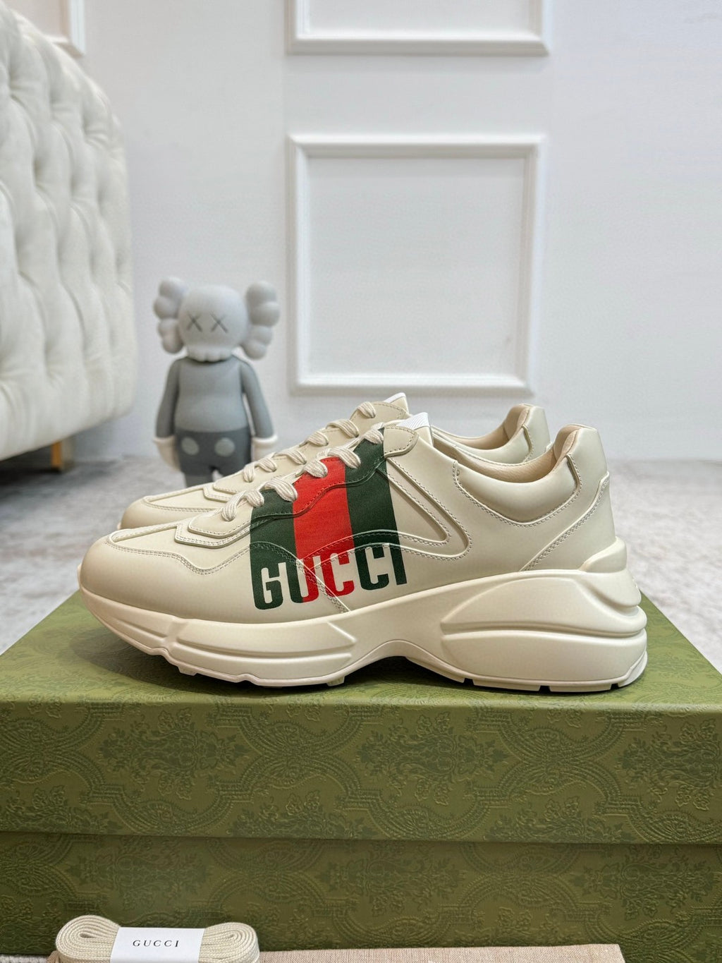 Gucci Men's Rhyton Retro Logo Sneakers in ivory leather with the signature green and red web print