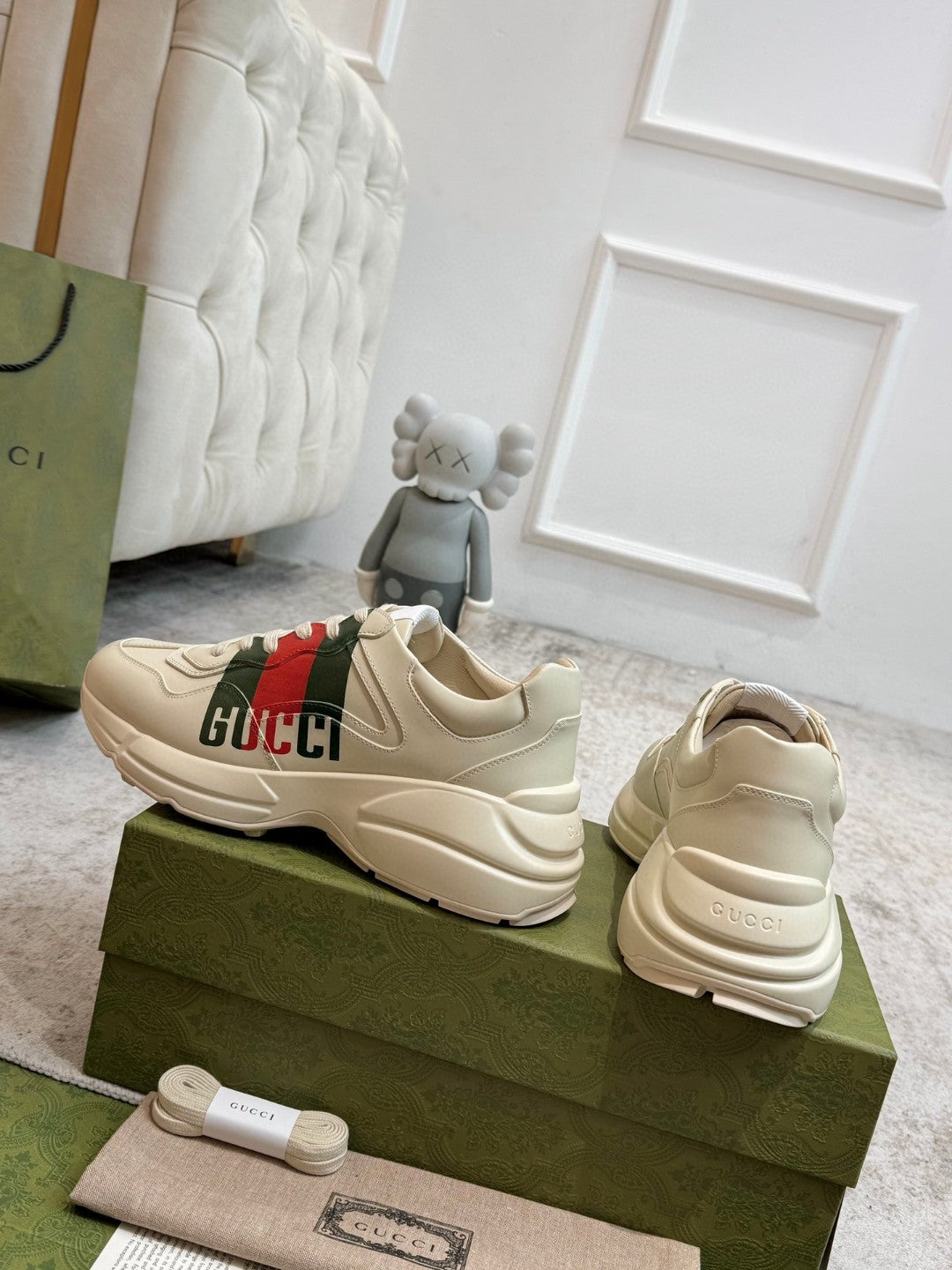 Gucci Men's Rhyton Retro Logo Sneakers in ivory leather with the signature green and red web print