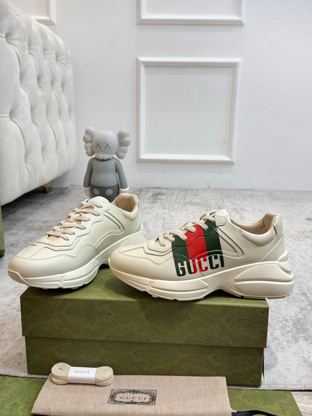 Gucci Men's Rhyton Retro Logo Sneakers in ivory leather with the signature green and red web print