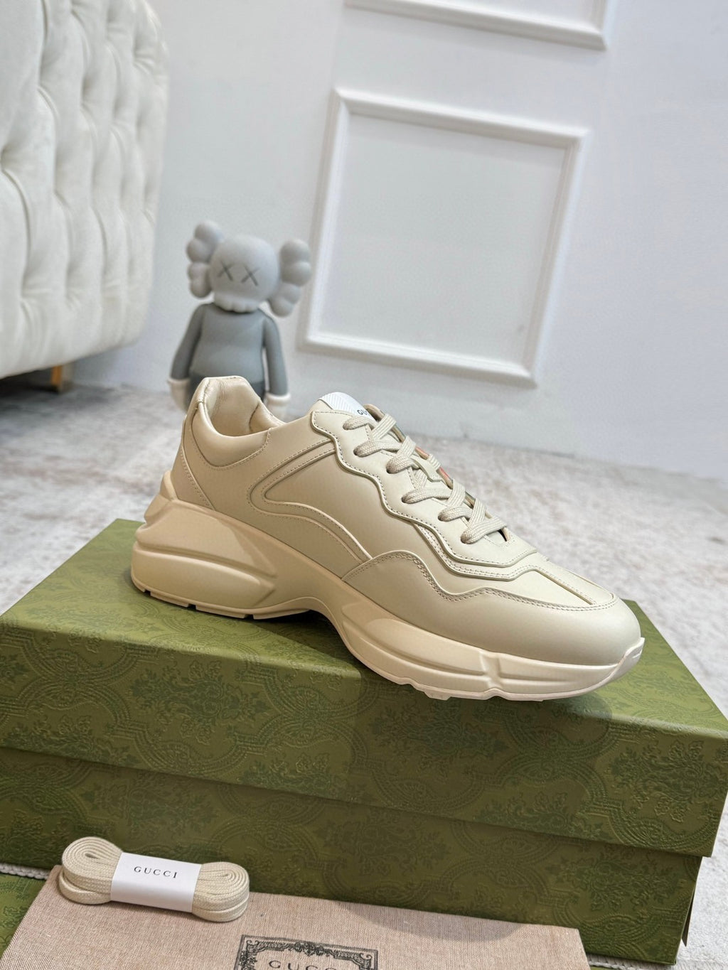 Gucci Men's Rhyton Retro Logo Sneakers in ivory leather with the signature green and red web print