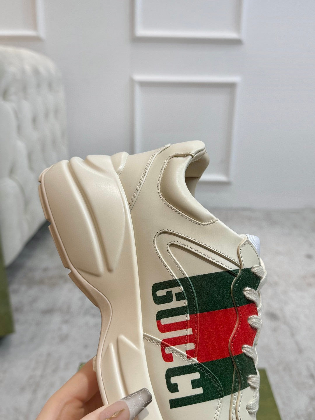 Gucci Men's Rhyton Retro Logo Sneakers in ivory leather with the signature green and red web print