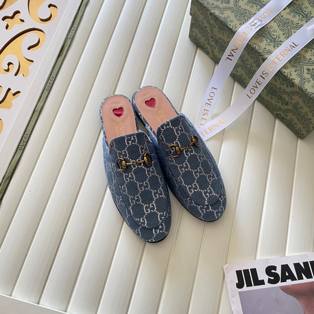 Gucci Princetown mules in light blue and ivory GG denim with gold-tone horsebit hardware