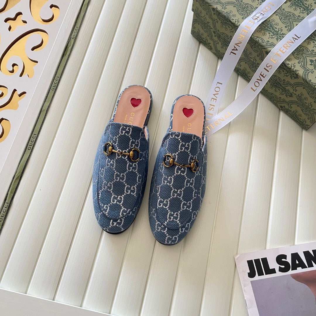 Gucci Princetown mules in light blue and ivory GG denim with gold-tone horsebit hardware