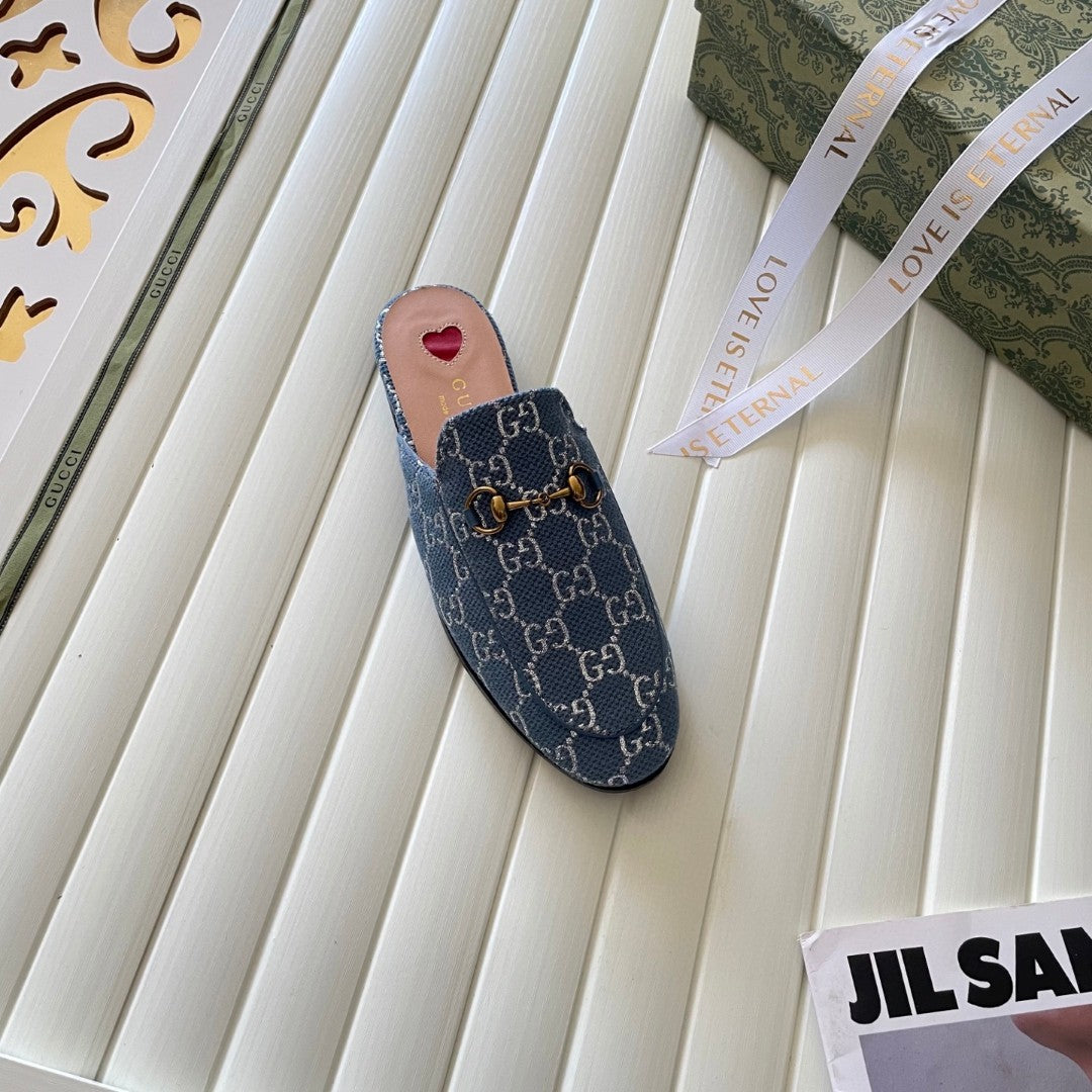 Gucci Princetown mules in light blue and ivory GG denim with gold-tone horsebit hardware